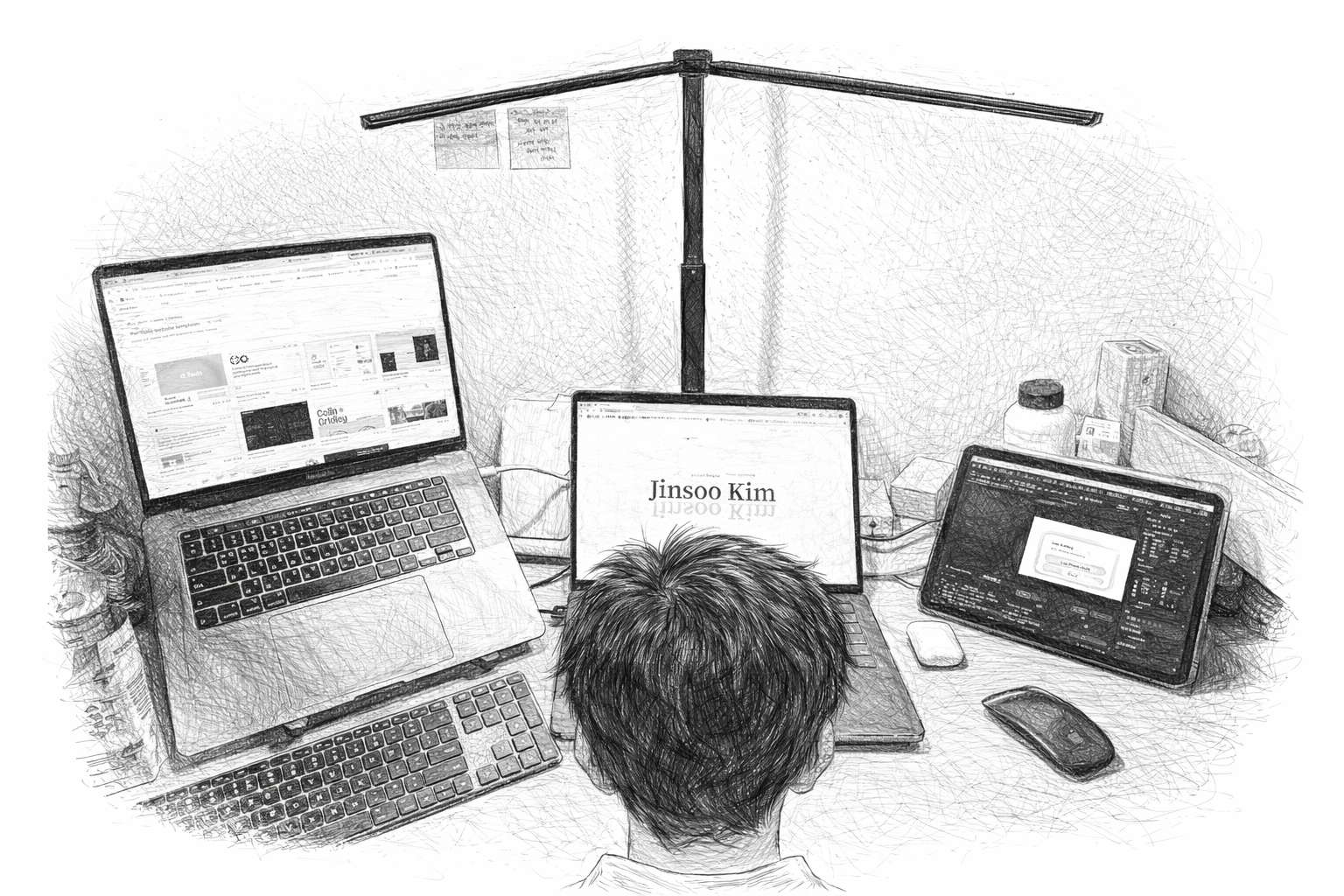 Jinsoo working at his desk with three devices